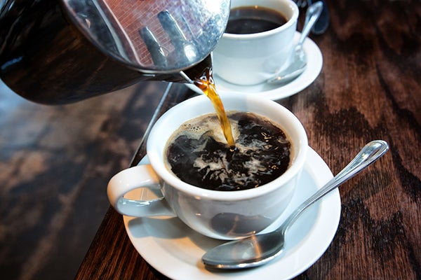 A college student points to too much consumption of coffee as among the factors affecting her health. | Image: grandriver/yIstock.com via AFP Relaxnews