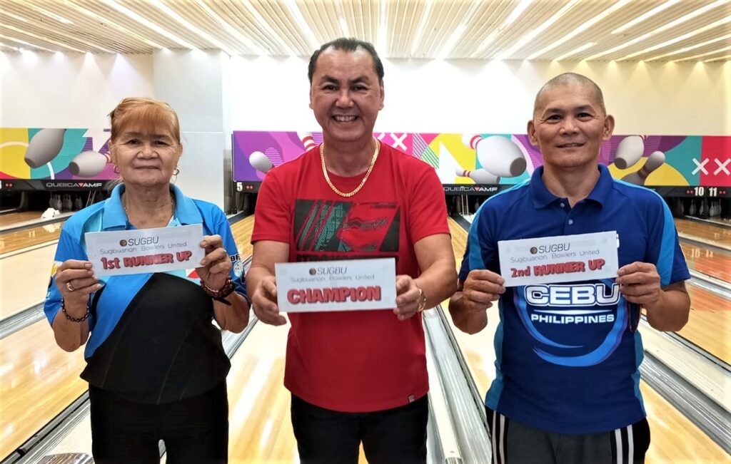 SUGBU Bowling Shootout tournament champion Rene Ceniza (middle) joins second placer Vivian Padawan (left) and third placer Roger Asumbrado (right) during the awarding ceremony.