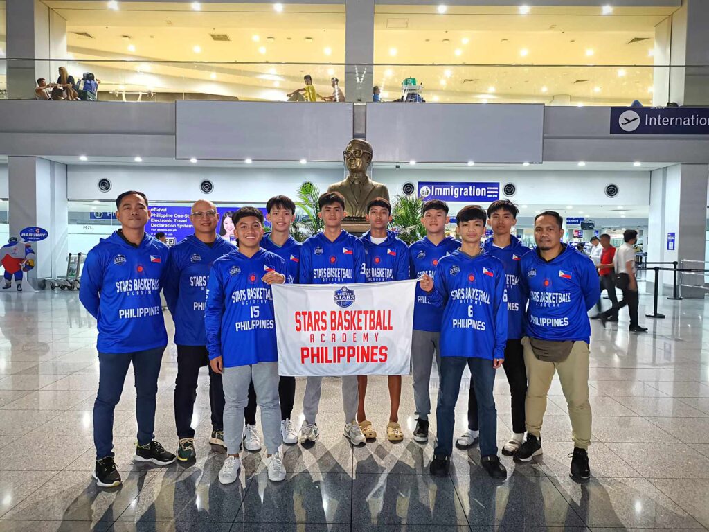 The Coach Raymerc STARS Basketball Academy pose for a group photo at the NAIA terminal along with head coach Raymond Mercader (rightmost) before departing for Taiwan.