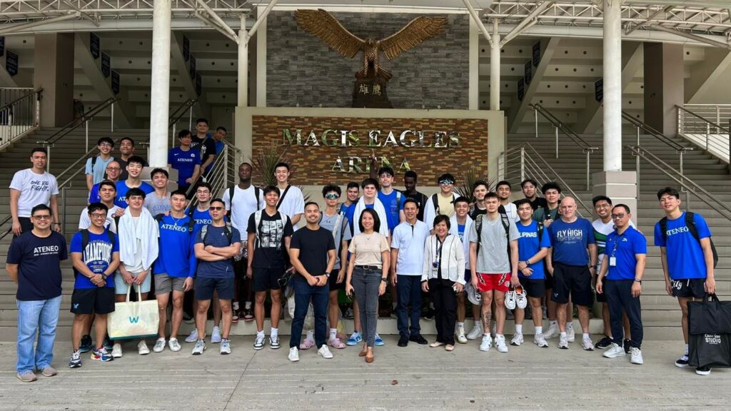Ateneo Blue Eagles team and coaching staff join SHS-AdC faculty members and officials for a group photo during their training camp at the latter's campus in Mandaue City with the Magis Eagles basketball team.