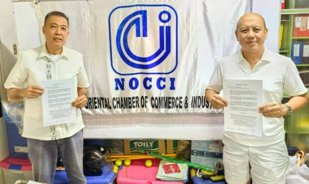 Edward Du (left), president of NOCCI, with QPA president Ruben Carballo during the signing of the MOA. Contributed Photo