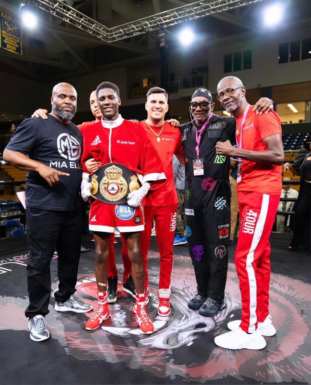 Domnique Crowder (wearing the WBA belt) poses with his team after beating Kenny Demecillo. | Photo from Crowder's Facebook page