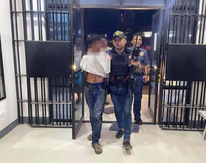 Man survives shooting attack in Dumanjug by alleged estranged hubby of his live-in partner in Dumanjug town. Heracleo Sarona, the alleged gunman, who shot and missed the partner of his estranged wife, is escorted inside the Dumanjug Police Station after he was arrested for allegedly shooting and missing the live-in partner of his estranged wife. | Dumanjug Police Station
