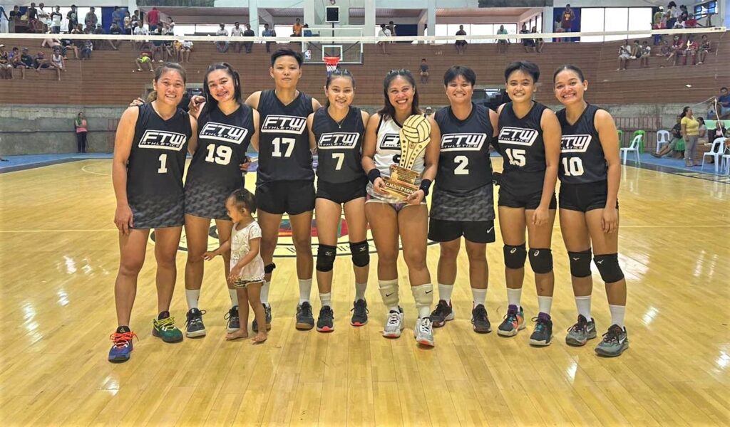 The FTW Athletics Cebu City women's volleyball team holding the trophy of the 52nd Araw ng Kadingilan volleyball tournament in Bukidnon recently. | Contributed photo