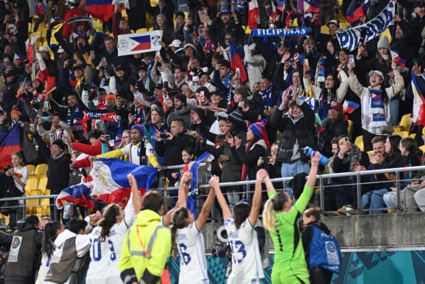 Spectators react as the Philippines teams celebrate following the Women’s World Cup Group A football match between New Zealand and the Philippines in Wellington, New Zealand, Tuesday, July 25, 2023. (AP Photo/Andrew Cornaga)
