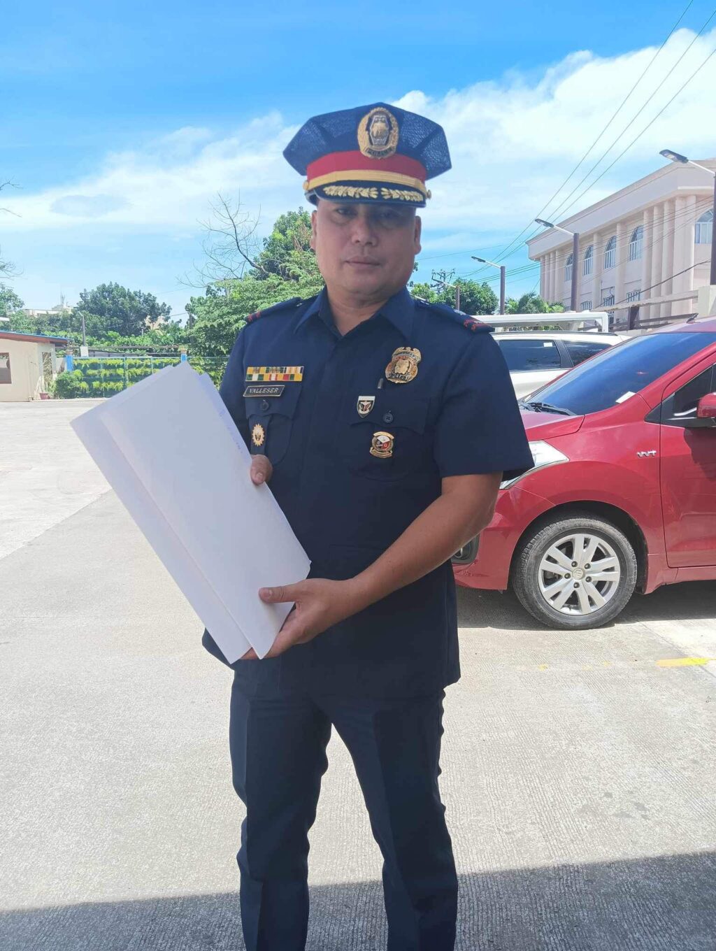 Police Major Angelito Valleser shows the documentary evidences that they attached to the murder charge against Simeon Gabutero Jr. and his younger brother.