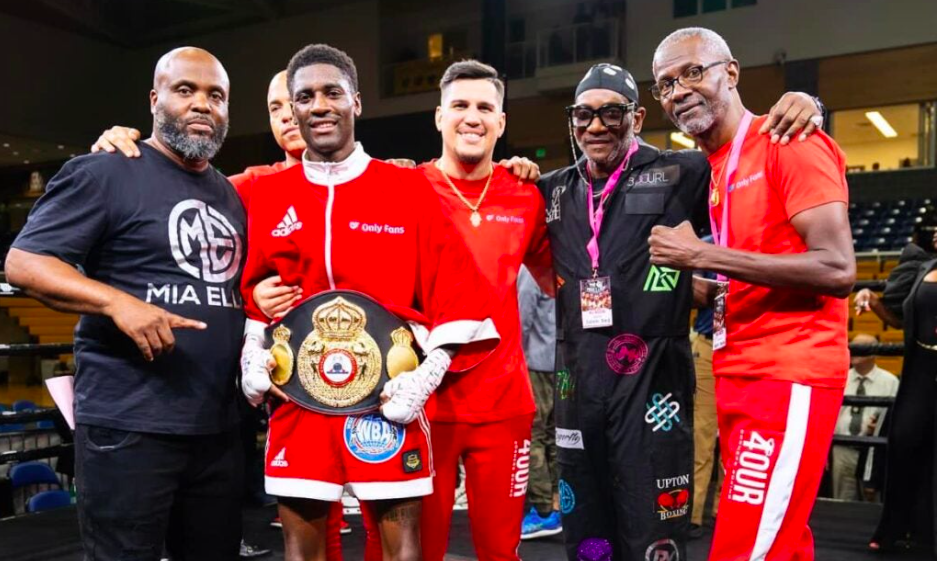 Domnique Crowder (wearing the WBA belt) poses with his team after beating Kenny Demecillo. | Photo from Crowder's Facebook page