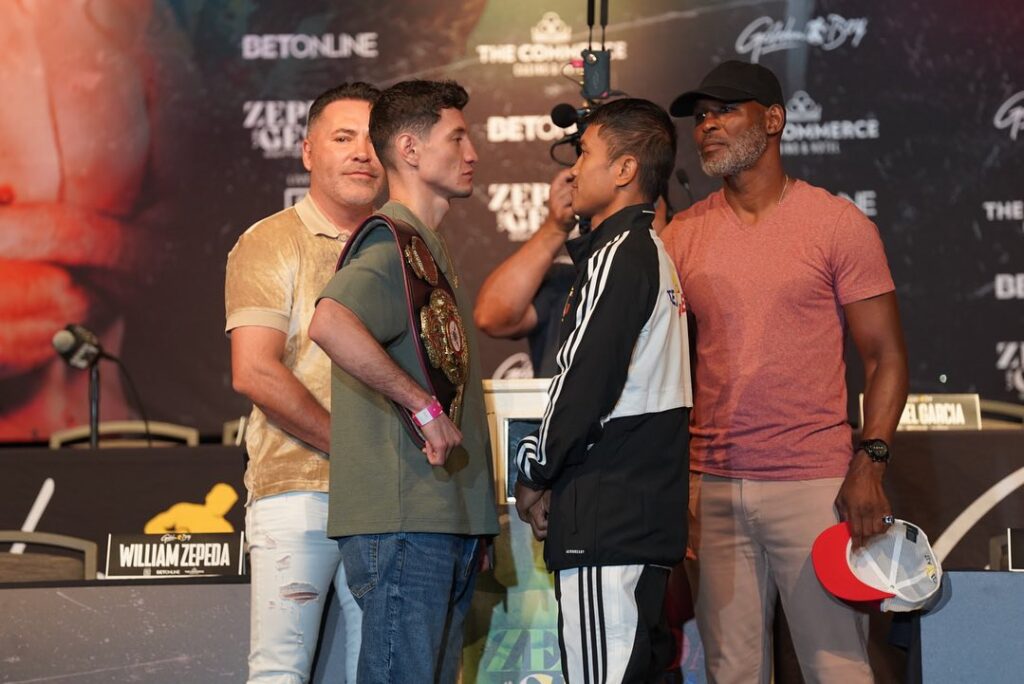 William Zepeda (left) and Mercito Gesta (right) stare at each other during their pre-fight presser in Commerce, California. Joining them are Golden Boy Promotions top brass Oscar Dela Hoya (left) and Bernard Hopkins (right).