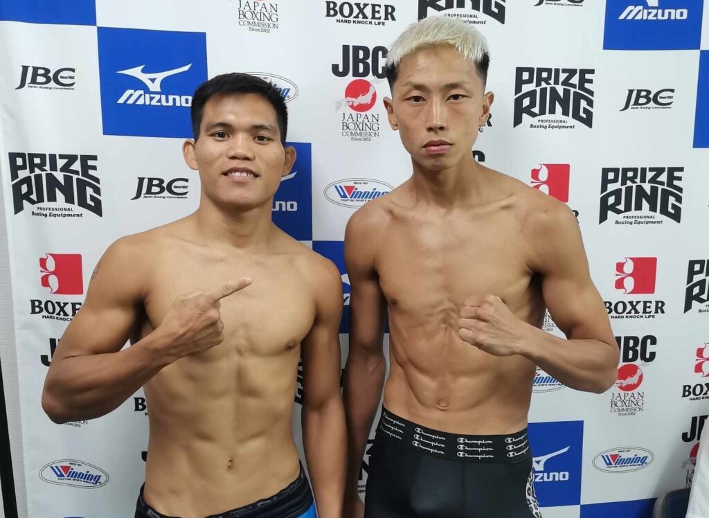 Jhunriel Castino (left) poses with Ryuya Tsugawa (right) after the weigh-in for their eight-rounder bout in Sakai, Japan.