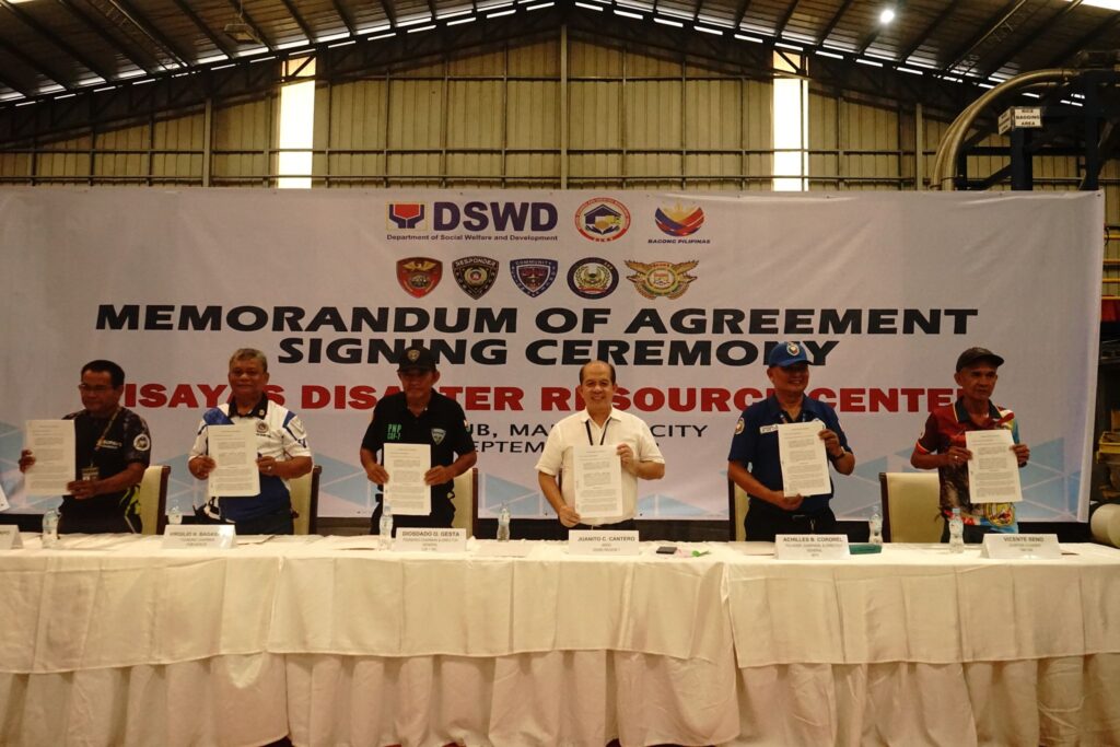 Participants of the MOA signing held on Thursday at the Visayas Disaster Resource Center of the Department of Social Welfare and Development (DSWD).