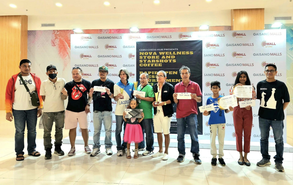 Anthony Makinano (in green shirt) poses with other winning woodpushers in the Nova Wellness and Starshots Coffee Open Chess tournament awarding ceremony. 