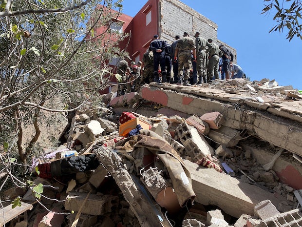 Rescuers carry out a search operation following a powerful earthquake, in Amizmiz, Morocco, Sept. 9, 2023. (Photo by ABDHELHAL BALHAKI / Reuters)