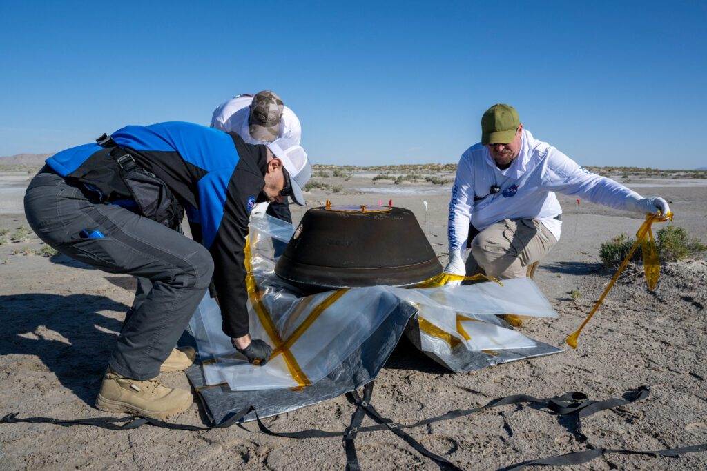 The return capsule containing a sample collected from the asteroid Bennu in October 2020 by NASA’s OSIRIS-REx spacecraft is seen shortly after touching down in the desert at the Department of Defense's Utah Test and Training Range in Dugway, Utah, U.S. September 24, 2023.  NASA/Keegan Barber/Handout via REUTERS