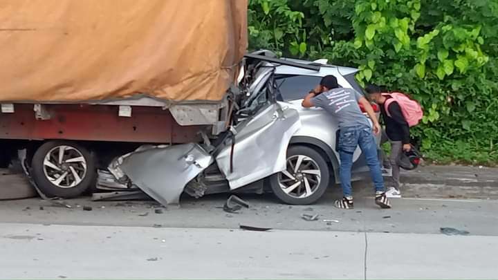 Bystanders check the vehicle that Dr. Annie Irene Rufo was driving when it met an accident in Argao town, southern Cebu early Monday morning, September 4, 2023. 