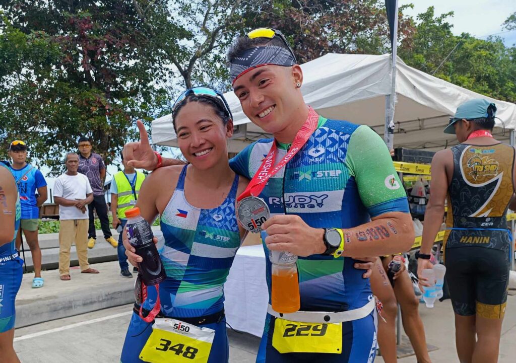 Kim Mangrobang (left) and Fernando Casares (right) pose for a photo at the finish line of the Dapitan 5150 Triathlon. | Glendale Rosal