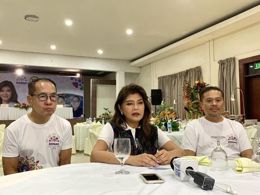 Senator Imee Marcos (center) talks with Cebu media on Sunday, September 17, 2023 during the celebration of Karansa Festival in Danao City. With her are Danao City Vice Mayor Ramon Durano III (left), and Danao City Mayor Thomas Mark Durano. | Niña Mae Oliverio