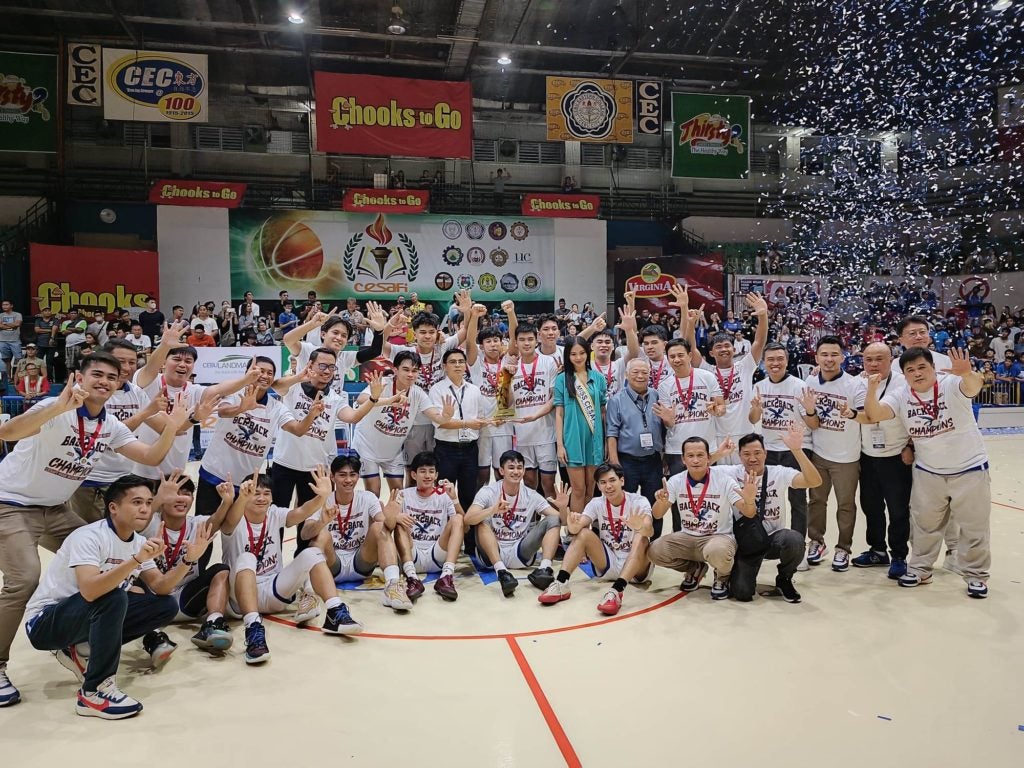 SHS-AdC Magis Eagles coaching staff and players pose at center court during the awarding of the Cesafi high school finals. | CDN file photo