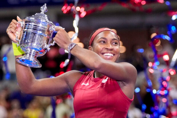 Coco Gauff, of the United States, holds up the championship trophy after defeating Aryna Sabalenka, of Belarus, in the women’s singles final of the U.S. Open tennis championships, Saturday, Sept. 9, 2023, in New York. (AP Photo/Frank Franklin II)