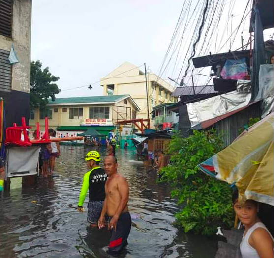 Personnel of the Mandaue City Disaster Risk Reduction and Management Office check on one of the flooded areas in Mandaue City. | Bantay Mandaue via Mary Rose Sagarino