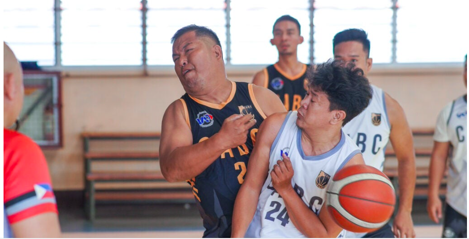 A player from AEG (black) and Diamond Built (white) gets physical during their semifinal game of the CABC 5th Corporate Cup. | Photo from CABC via Ronex Tolin