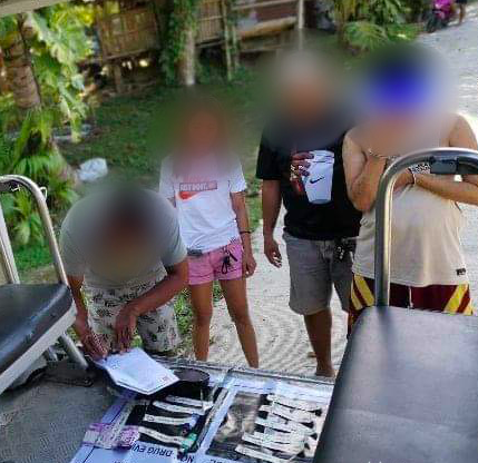 A public school teacher (right) is arrested after he was caught with .3 grams of suspected shabu during a buy-bust operation on Sept. 17, 2023, in Barili town. | Barili Police via Paul Lauro