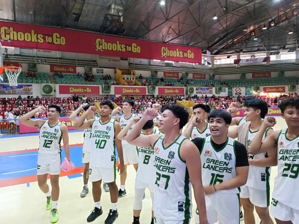 UV Green Lancers players celebrate by singing their university hymn after beating CIT-U Wildcats in the Cesafi men's basketball.