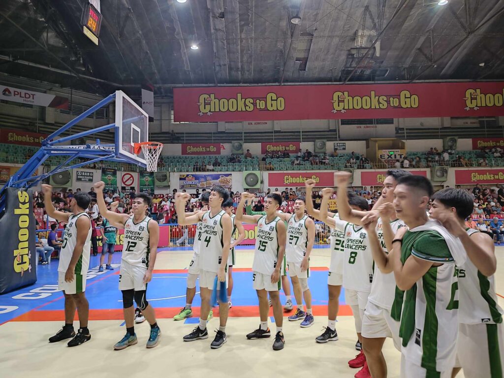 UV Green Lancers players celebrate after their win against the USJ-R Jaguars in the Cesafi.
