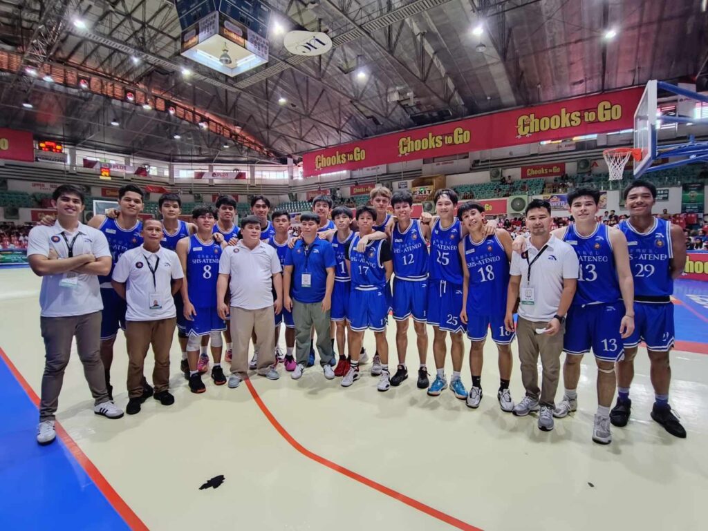 SHS-AdC Magis Eagles players and coaching staff pose for a photo after beating CBSAA Trailblazers in Cesafi high school basketball on Sunday.