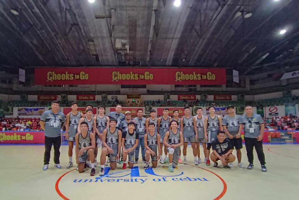 CRMC Mustangs players and coaching staff pose at center court after winning against USC in their game in the Cesafi on Sunday, October 22.