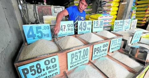 Photo showing a rice vendor for story: DA ‘working double time’ to lower prices of rice to P20 per kilo