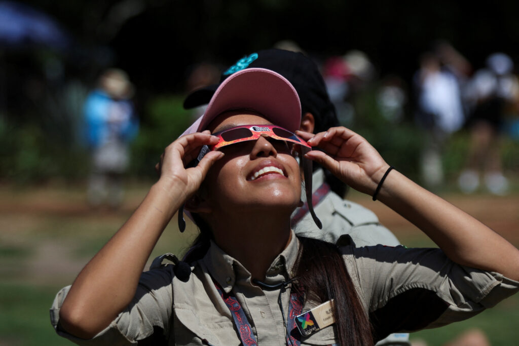 ‘Ring of fire’ eclipse brings cheers, shouts of joy as it moves across the Americas. In photo is a person using protective glasses to watch the solar eclipse at the Chichen Itza archaeological zone, in Piste, Mexico, October 14, 2023. REUTERS/Lorenzo Hernandez