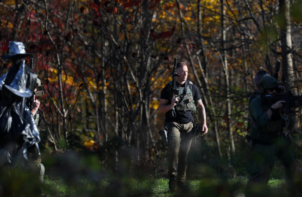 Members of law enforcement work as the search for the suspect in the deadly mass shootings in Lewiston continues, in Monmouth, Maine, U.S. October 27, 2023. The suspect was later found dead in Lisbon Falls. REUTERS/Shannon Stapleton