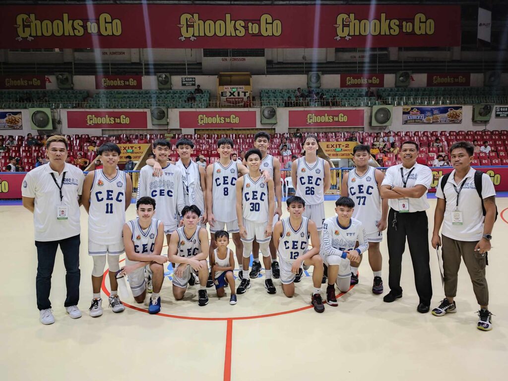 CEC Dragons' players and officials pose for a group photo after beating CBSAA Trailblazers in the Cesafi high school basketball. | Glendale Rosal