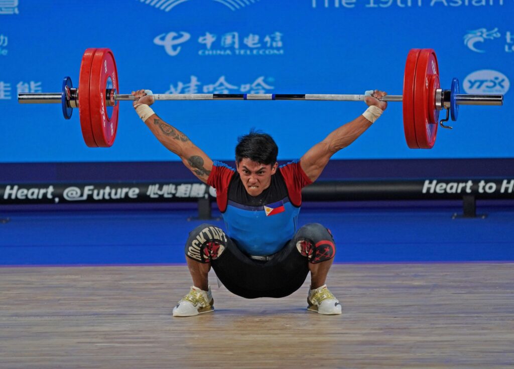 Cebuano weightlifter Ceniza reflects on Asiad 'mistakes': I'll do better next time. In photo is John Febuar Ceniza during the Asian Games. | Photo from PSC-POC Asian Games Media Pool