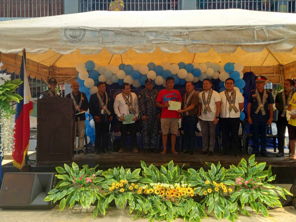63 inmates or PDLs graduate from Mandaue’s jail-based rehab program. A former person deprived of liberty or inmate of Mandaue City Jail receives his certificate of completion of the Mandaue City government's Jail-based rehab program. | Mary Rose Sagarino