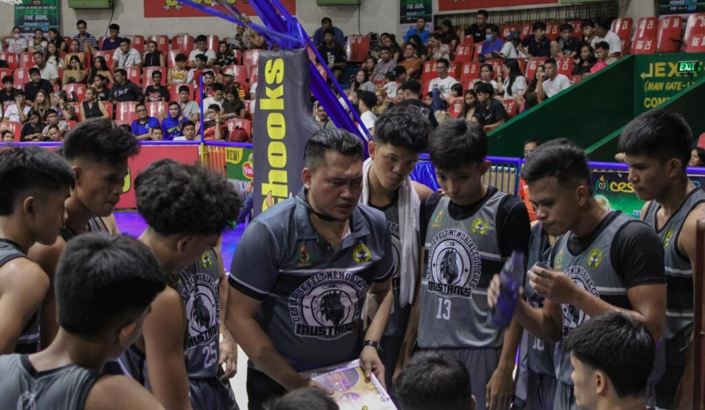 CRMC coach Paul Alelu Flores (holding a board), during one of their Cesafi games. | Photo from CESAFI