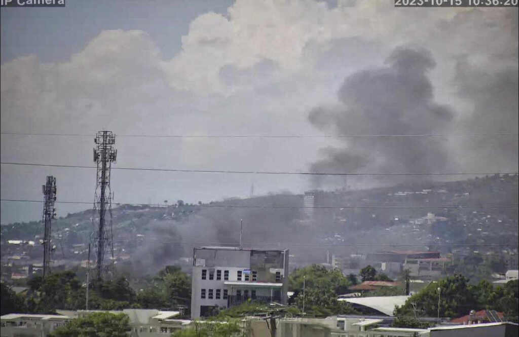 Black smoke is seen in a residential area in Barangay Guadalupe, Cebu City where a fire destroyed a house. | Contributed photo via Paul Lauro
