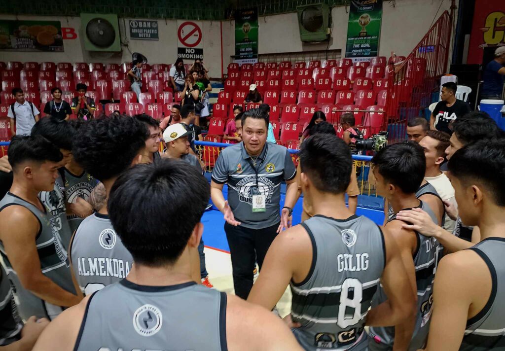 CRMC head coach Paul Alelu Flores talking to his players after beating UP-Cebu in Cesafi men's basketball. | Glendale Rosal