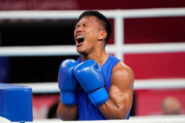 Philippines Eumir Felix Marcial reacts after defeating Syria’s Ahmad Ghousoon during the Boxing Men’s 71-80Kg Semifinal bout for the 19th Asian Games in Hangzhou, China, Wednesday, Oct. 4, 2023. (AP Photo/Aijaz Rahi)