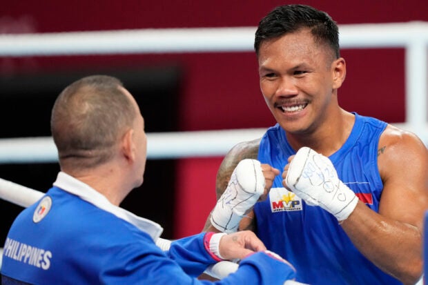 The Philippines’ Eumir Felix Marcial at right reacts after defeating Syria’s Ahmad Ghousoon in the Boxing Men’s 71-80Kg Semifinal bout for the 19th Asian Games in Hangzhou, China, Wednesday, Oct. 4, 2023. (AP Photo/Aijaz Rahi)