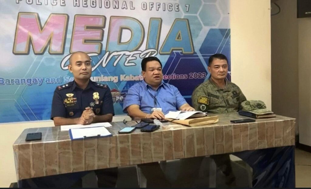 Police Lieutenant Colonel Gerard Ace Pelare, PRO-7 spokesperson; Attorney Lionel Marco Castillano, Comelec-7 director; and Colonel Erwin Lamzon, commander of JTG and the 3rd Infantry Division, speak in a press conference on Monday, October 30, 2023 to discuss alleged vote-buying incidents in the region.