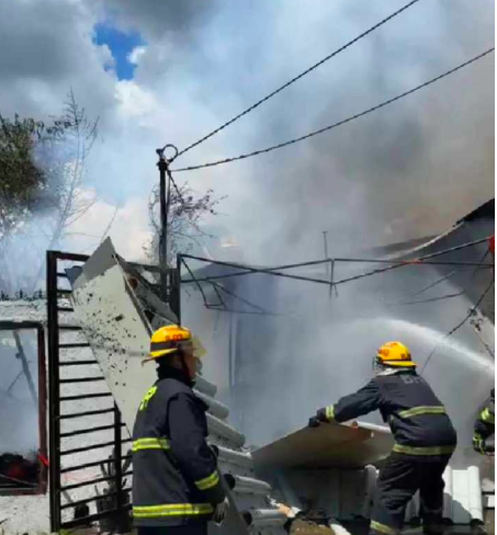 Firefighters battle the fire that hit a house in Barangay Guadalupe in Cebu City at past 10 a.m. today, October 15, 2023. | Contributed photo via Paul Lauro