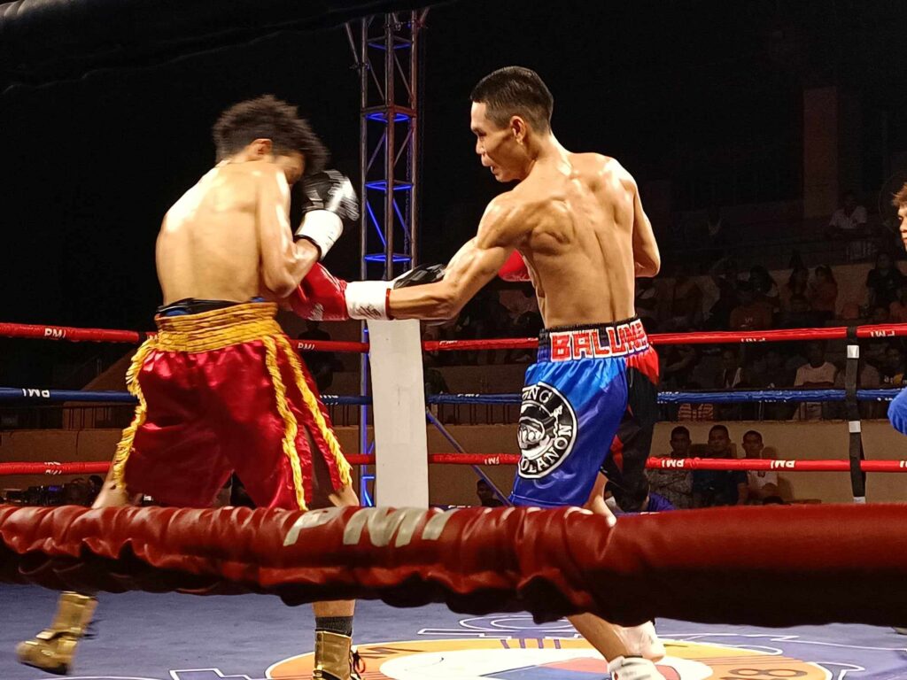Christian Balunan throws a left uppercut to Adetip Maungchaoren during their WBO Asia Pacific mini flyweight title bout on Saturday, Nov. 4, 2023.