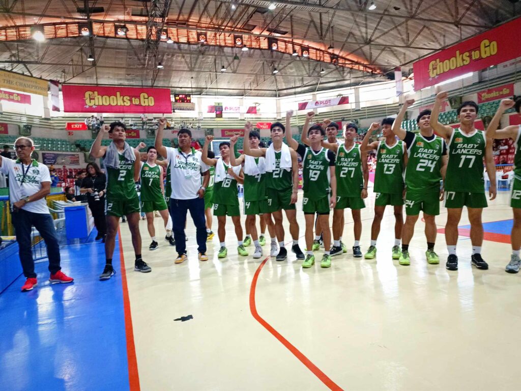 UV Baby Green Lancers players and coaching staff chant their school hymn after beating the UC Baby Webmasters in their game in the Cesafi on Sunday, November 12, 2023.