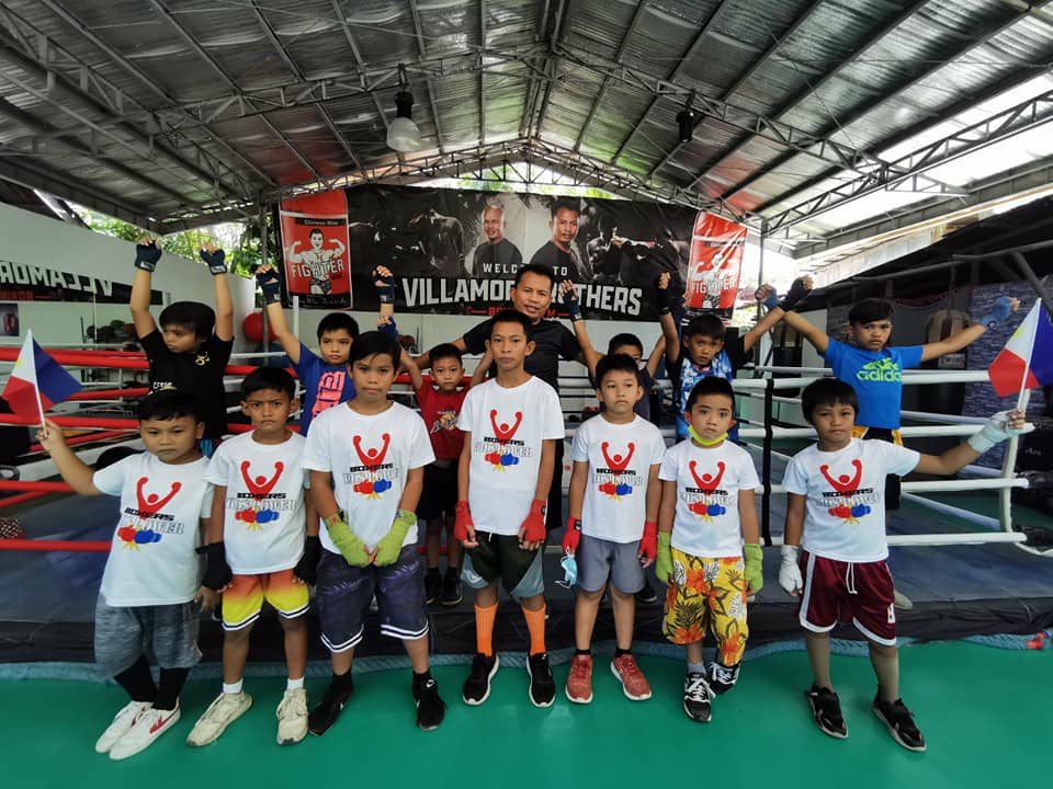 Edito Villamor and his young boxers at the Villamor Boxing Gym in Barangay Pagsabungan, Mandaue City.