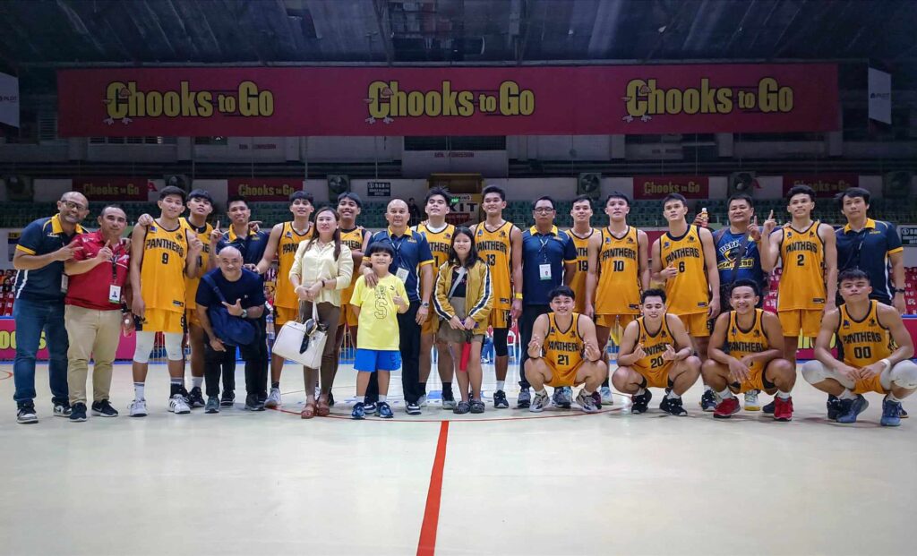 USPF Panthers players and coaching staff pose for a group photo after narrowly beating USJ-R Jaguars in overtime during their game in the Cesafi on Saturday, Nov. 18, 2023. 