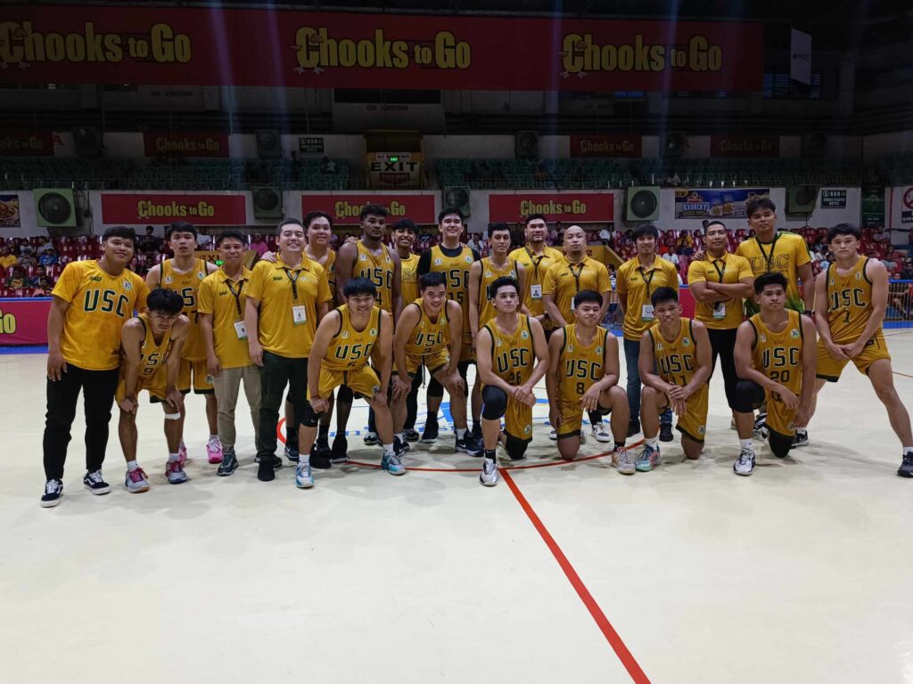 The USC Warriors players and coaching staff pose for a group photo after beating Benedicto College in the Cesafi.