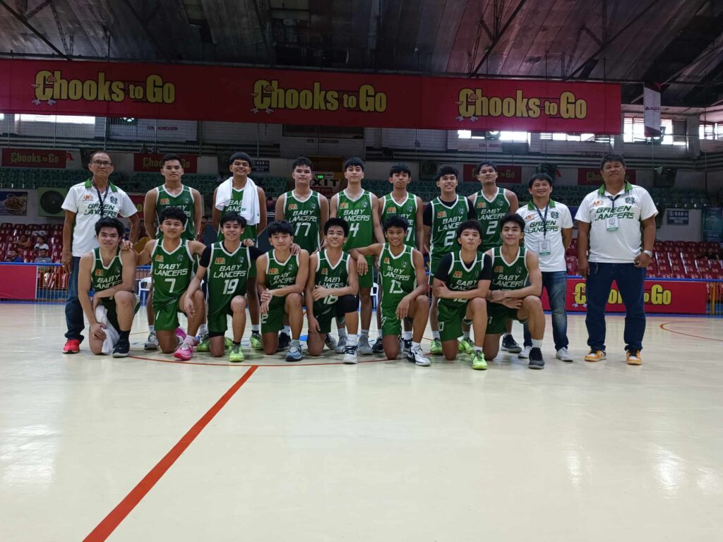 UV Baby Green Lancers team officials and players pose for a photo at center court after beating the CBSAA Trailblazers during their game in the Cesafi on Saturday, November 25, 2023.