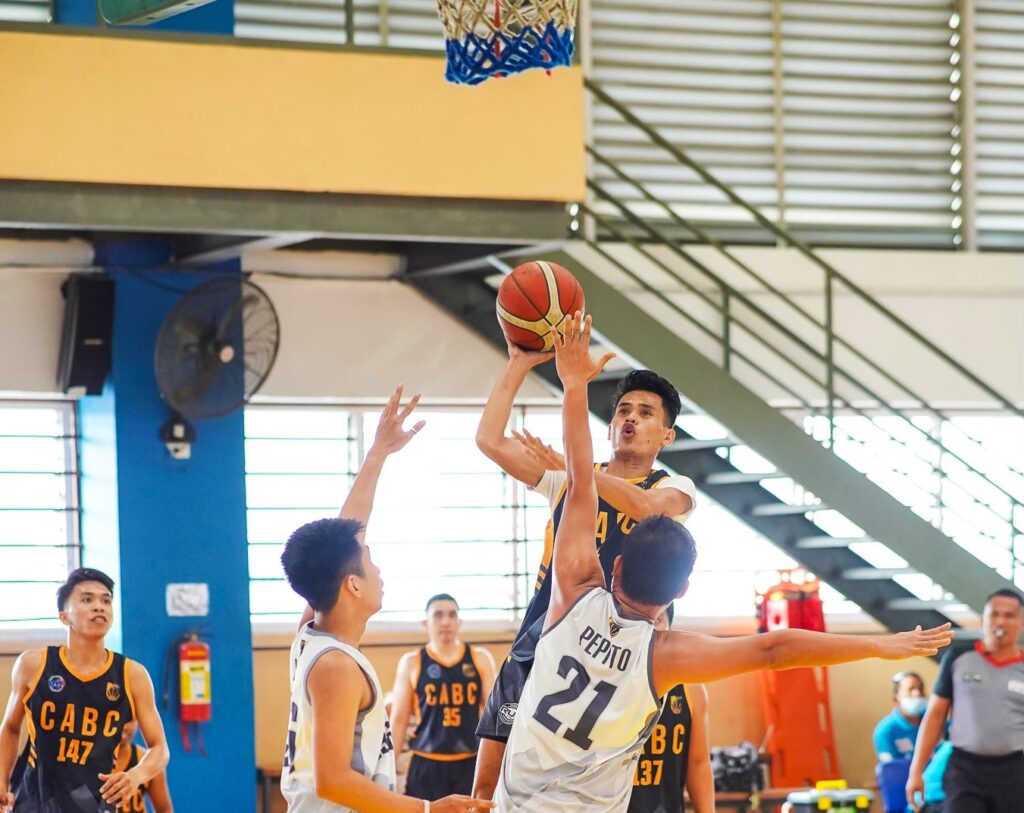 Nation Paints' John Therese Buhawe attempts a difficult shot while being heavily defended by Knoxout's players during their CABC Boysen Cup 2023 semifinals game.