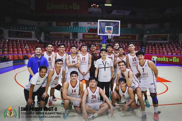 SWU Phinma Cobras players and coaching staff pose for a photo after beating CRMC Mustangs in their last Cesafi Season 23 game. | Cesafi photo